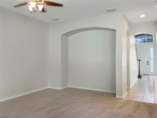 carpeted empty room with ceiling fan