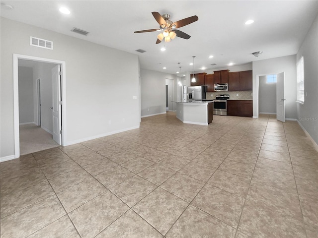 interior space featuring ceiling fan and light tile patterned flooring