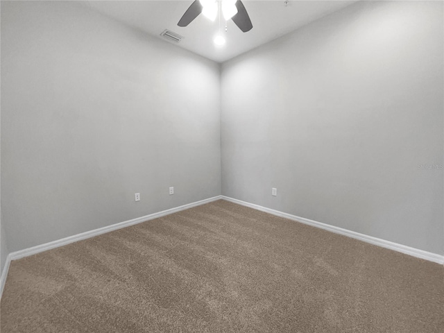 spare room with carpet floors and ceiling fan