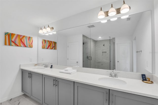 bathroom with double vanity, tile patterned flooring, and walk in shower