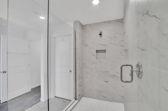 bathroom featuring tile patterned flooring and a shower with door