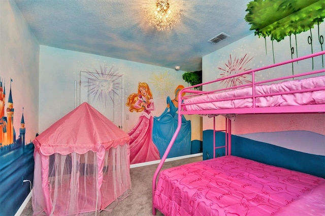 carpeted bedroom featuring a textured ceiling