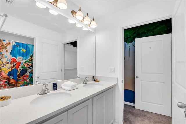 bathroom featuring dual vanity