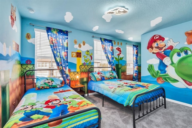 bedroom featuring carpet, multiple windows, and a textured ceiling