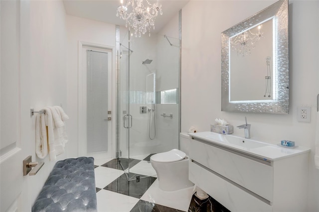 bathroom featuring a shower with shower door, tile patterned flooring, toilet, vanity, and a notable chandelier