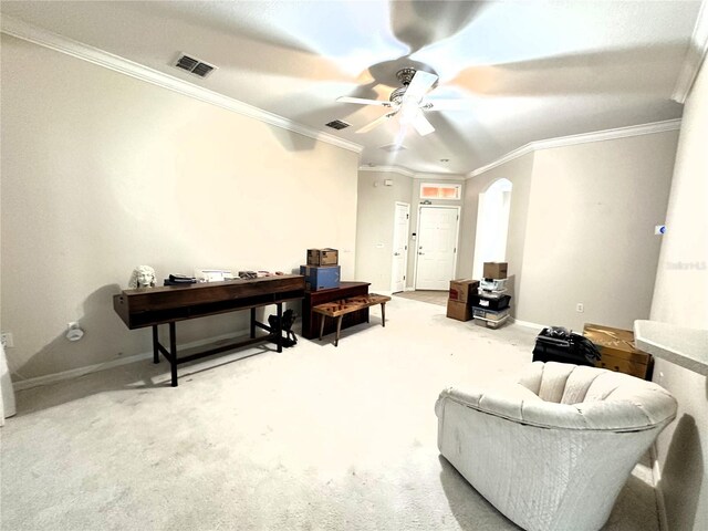 681 Coronado Dr, Kissimmee, FL 34759 - carpeted living room featuring ornamental molding, baseboards, arched walkways, ceiling fan, and visible vents