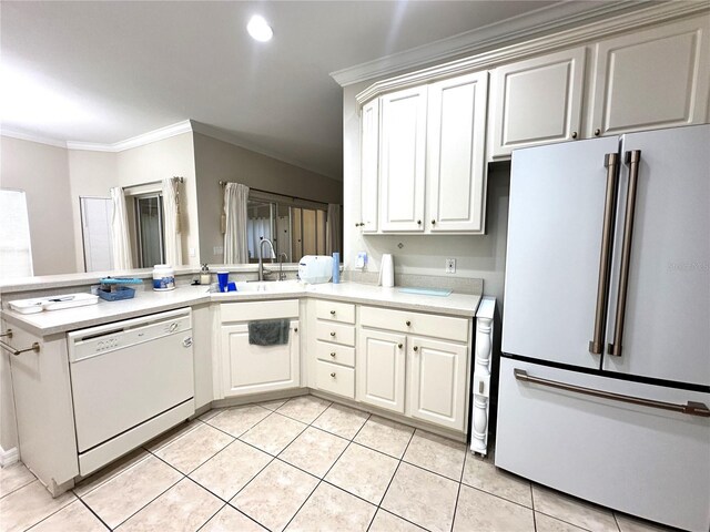 681 Coronado Dr, Kissimmee, FL 34759 - kitchen with crown molding, light countertops, a sink, light tile patterned floors, and white appliances