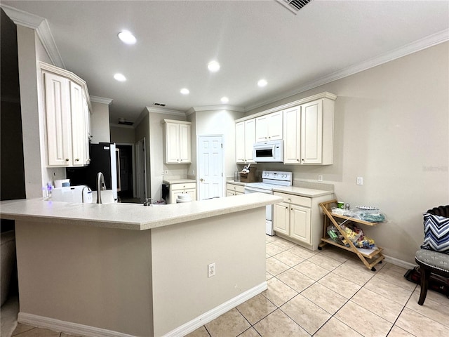 681 Coronado Dr, Kissimmee, FL 34759 - kitchen featuring light countertops, a peninsula, crown molding, and white appliances