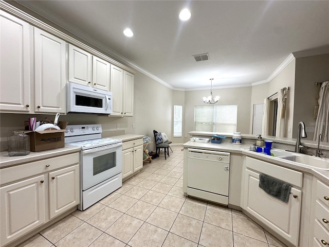 681 Coronado Dr, Kissimmee, FL 34759 - kitchen with visible vents, a chandelier, crown molding, white appliances, and a sink