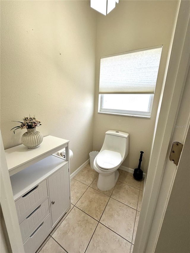 681 Coronado Dr, Kissimmee, FL 34759 - bathroom with toilet, baseboards, and tile patterned flooring