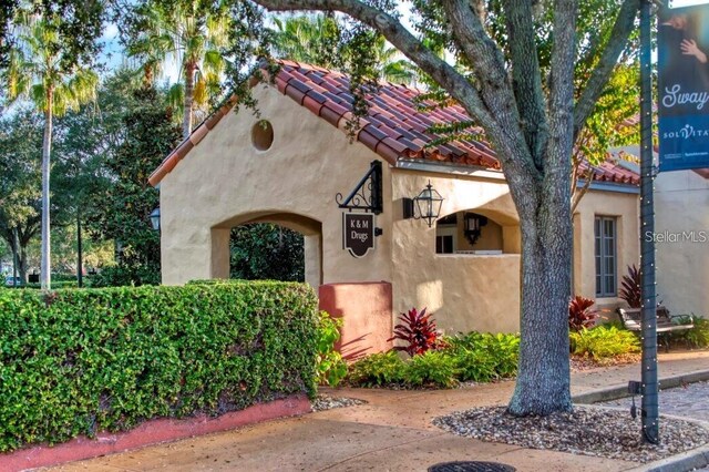 681 Coronado Dr, Kissimmee, FL 34759 - view of front of home with stucco siding and a tiled roof