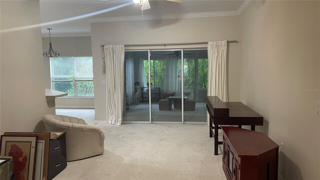 681 Coronado Dr, Kissimmee, FL 34759 - living area with carpet floors, crown molding, and a ceiling fan