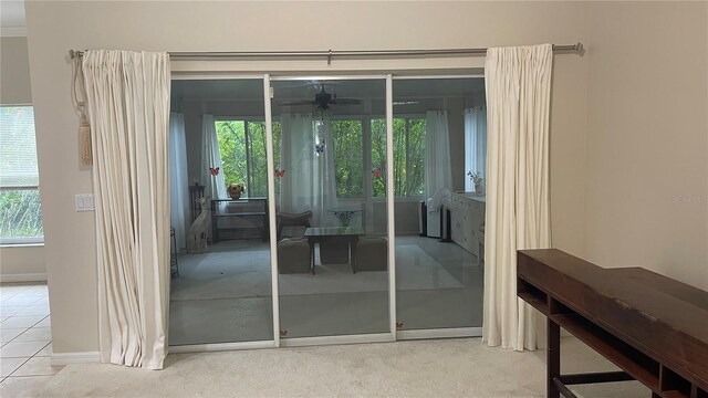 681 Coronado Dr, Kissimmee, FL 34759 - doorway featuring ceiling fan, plenty of natural light, and tile patterned floors