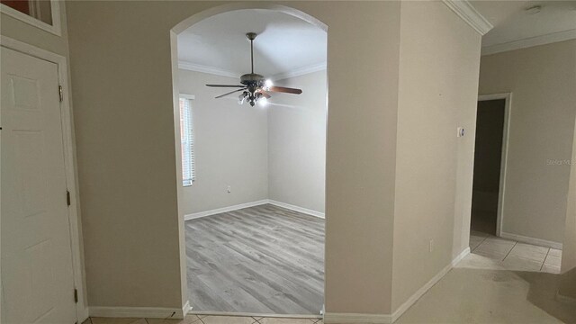 681 Coronado Dr, Kissimmee, FL 34759 - unfurnished room with crown molding, arched walkways, a ceiling fan, and a smoke detector