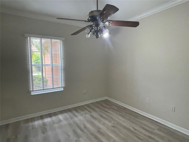 681 Coronado Dr, Kissimmee, FL 34759 - empty room with ornamental molding, ceiling fan, and wood finished floors