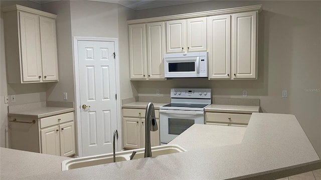 681 Coronado Dr, Kissimmee, FL 34759 - kitchen featuring white appliances, light countertops, and crown molding