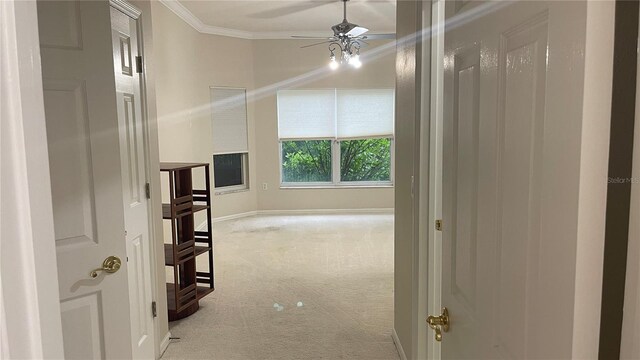 681 Coronado Dr, Kissimmee, FL 34759 - corridor featuring light colored carpet and crown molding