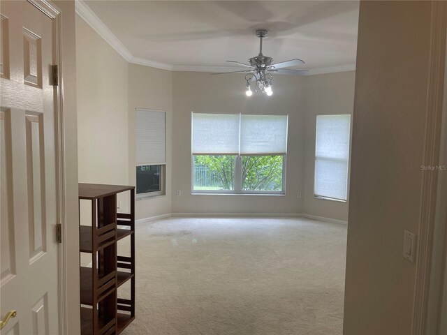 681 Coronado Dr, Kissimmee, FL 34759 - carpeted empty room with a ceiling fan and crown molding