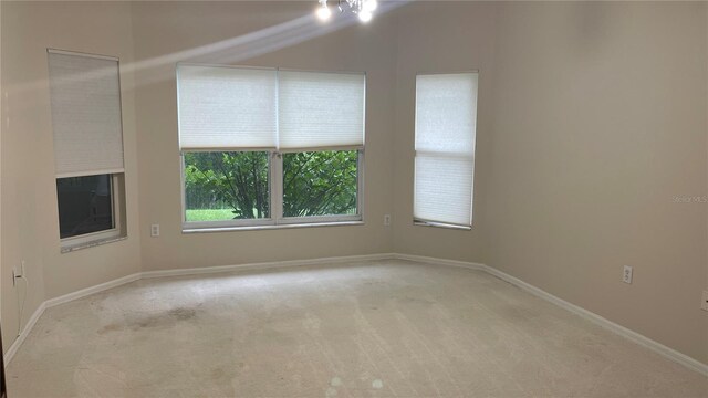 681 Coronado Dr, Kissimmee, FL 34759 - unfurnished room with light colored carpet and baseboards