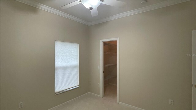 681 Coronado Dr, Kissimmee, FL 34759 - empty room with ceiling fan, crown molding, light colored carpet, and a smoke detector