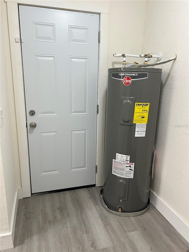 utility room with electric water heater