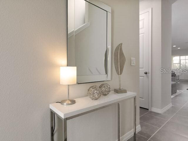 interior space featuring dark tile patterned floors