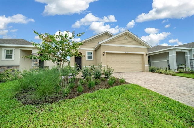 view of front of property featuring a garage and a front yard