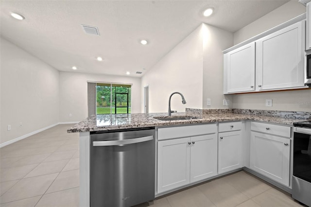 kitchen with white cabinetry, appliances with stainless steel finishes, sink, and kitchen peninsula