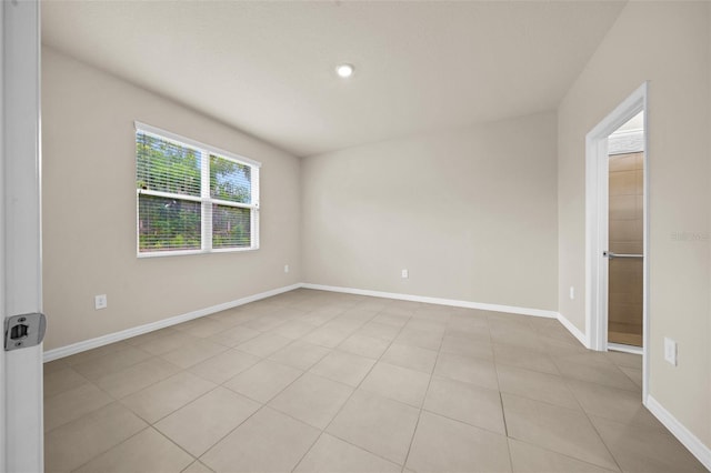 empty room featuring light tile patterned floors