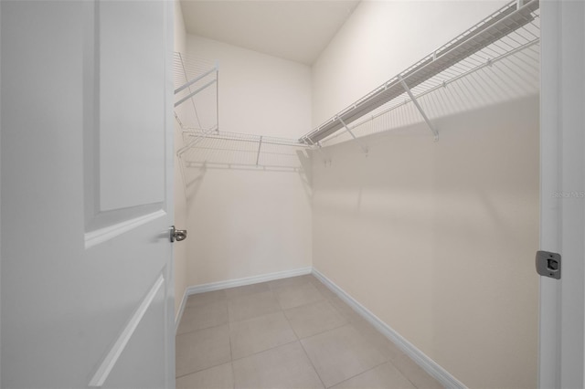 spacious closet featuring light tile patterned flooring