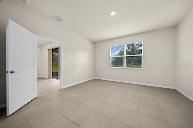 view of tiled spare room