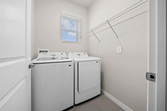 washroom with light tile patterned flooring and separate washer and dryer