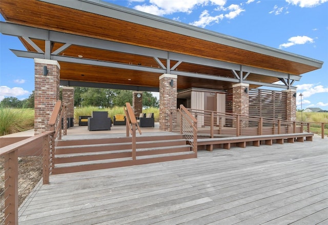 wooden terrace featuring an outdoor hangout area