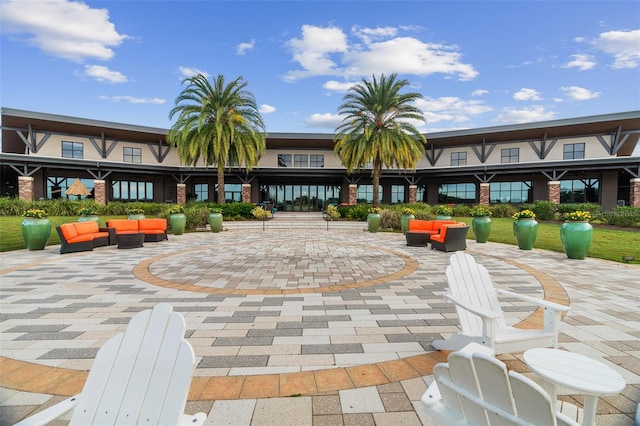 view of community with a patio area and outdoor lounge area