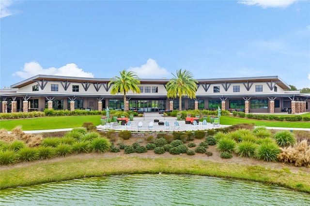 exterior space featuring a water view and a yard