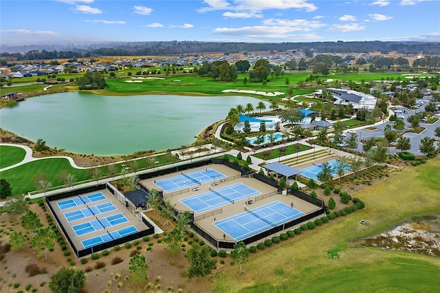 birds eye view of property with a water view