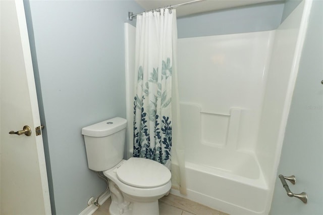 bathroom featuring shower / bathtub combination with curtain, toilet, and tile patterned floors