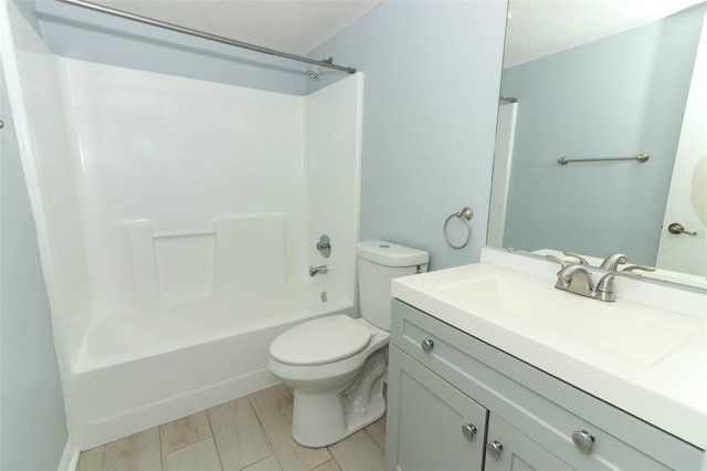 full bath with washtub / shower combination, vanity, toilet, and wood finished floors