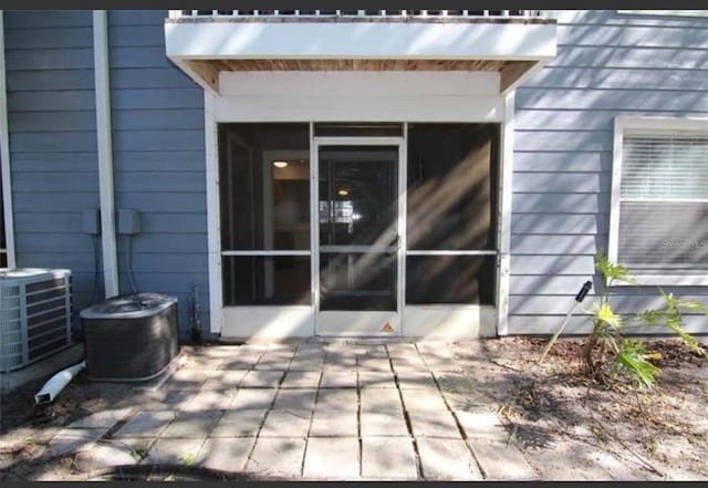 exterior space with central AC and a patio