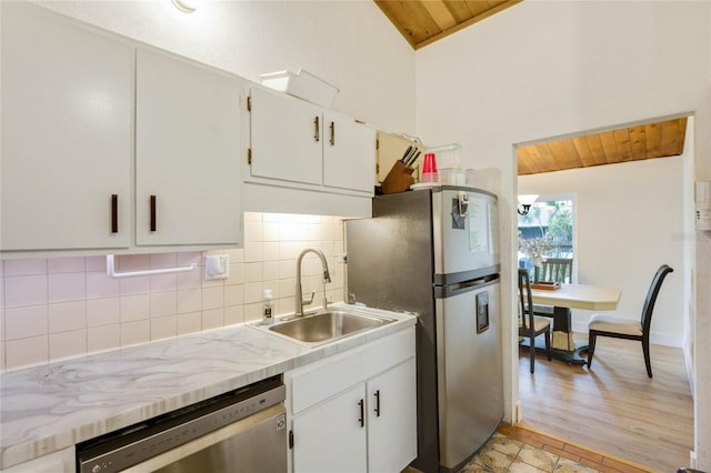 200 Maitland Ave Unit 2, Altamonte Springs, FL 32701 - kitchen with a sink, appliances with stainless steel finishes, wooden ceiling, vaulted ceiling, and decorative backsplash