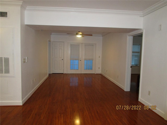 spare room featuring ceiling fan, dark hardwood / wood-style floors, crown molding, and french doors