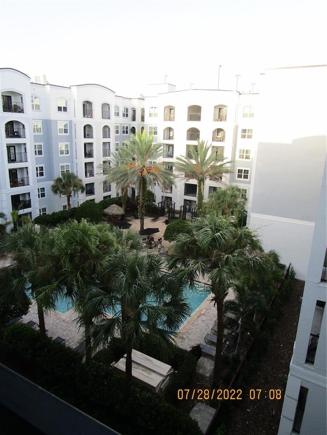 view of building exterior with a community pool