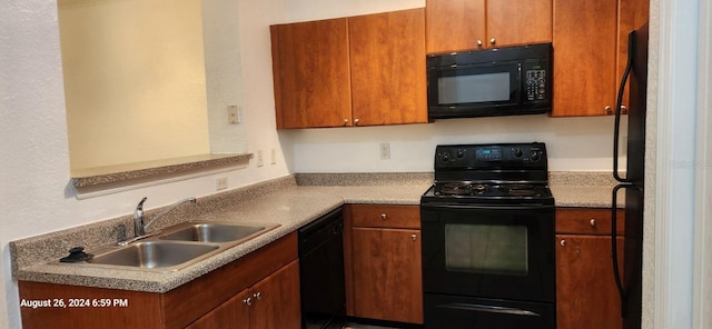 kitchen featuring sink and black appliances