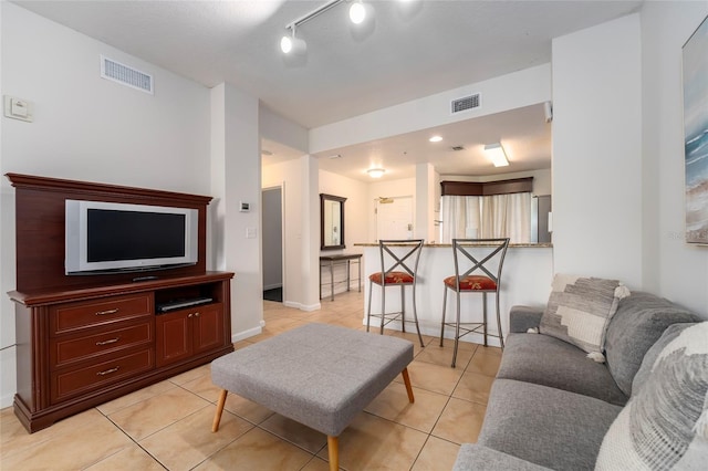 living room with light tile patterned floors