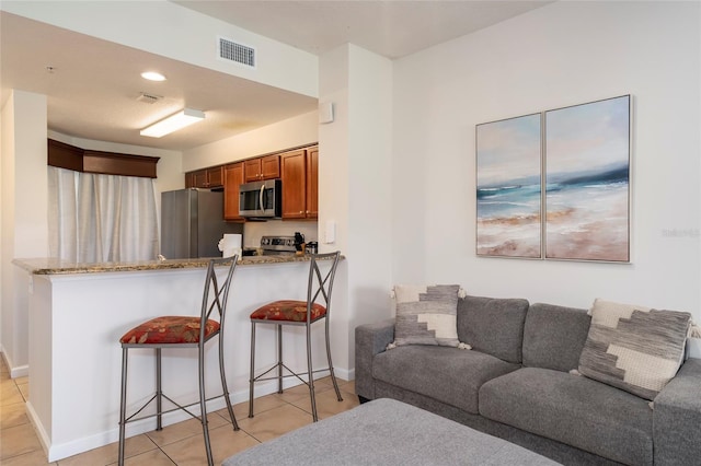 living room featuring light tile patterned floors