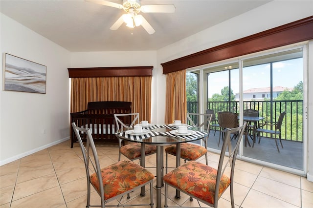 dining space with ceiling fan and light tile patterned flooring