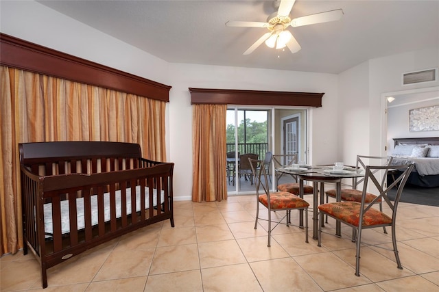 bedroom with ceiling fan and light tile patterned flooring