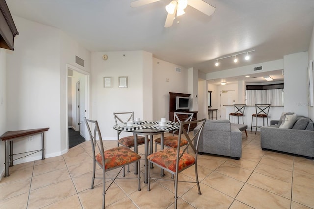 dining area with ceiling fan and light tile patterned floors