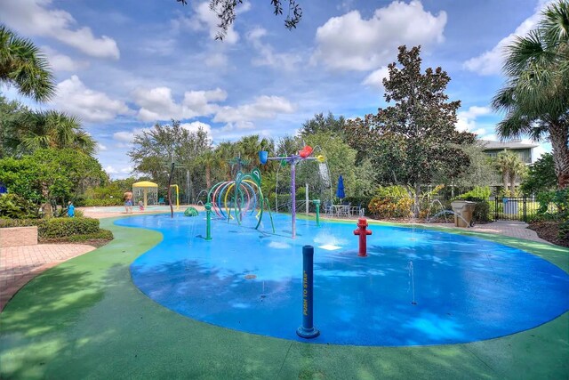 view of swimming pool featuring pool water feature