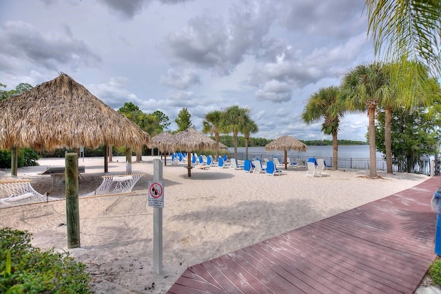 surrounding community with a gazebo and a water view